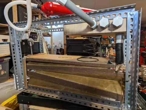The insides of an organ with bellows and the spring