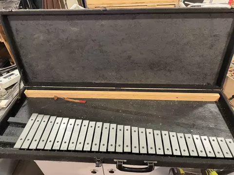 Glockenspiel bars mounted into a hard-sided instrument case