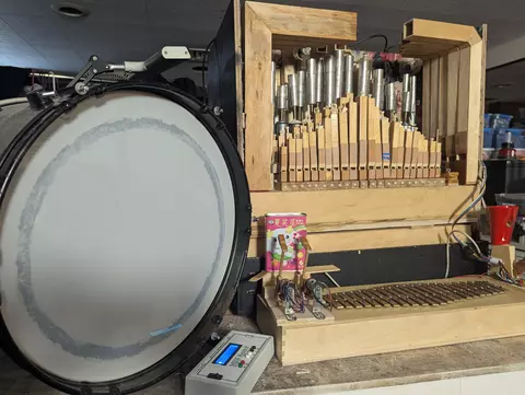 Self playing small organ with bells and percussion