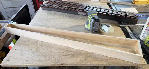 Home made tapered wooden box for holding xylophone bars