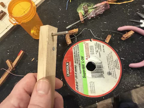 Spring winding tool and wire spool