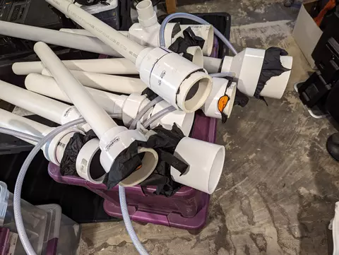Purple bin with horns made out of white PVC pipes