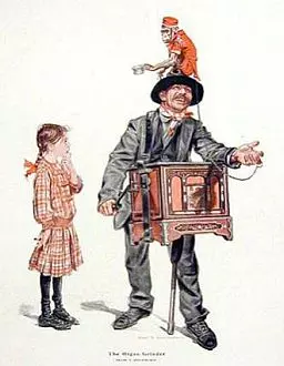 An organ grinder with a monkey