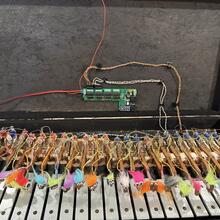 Electromechanical glockenspiel mounted in a hard case