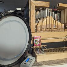 Self playing small organ with bells and percussion